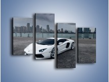 Obraz na płótnie – Lamborghini Aventador na tle miasta – czteroczęściowy TM197W2