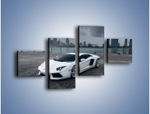 Obraz na płótnie – Lamborghini Aventador na tle miasta – czteroczęściowy TM197W3