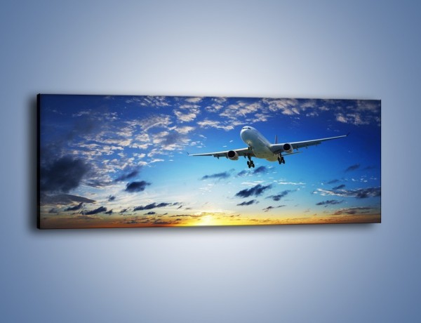 Obraz na płótnie – Samolot na tle zachodzącego słońca – jednoczęściowy panoramiczny TM118
