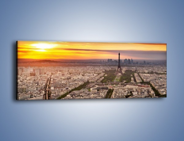 Obraz na płótnie – Zachód słońca nad Paryżem – jednoczęściowy panoramiczny AM420