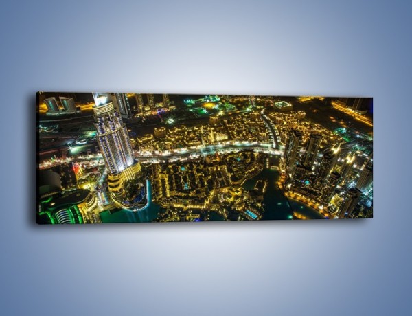 Obraz na płótnie – Dubaj nocą z lotu ptaka – jednoczęściowy panoramiczny AM507