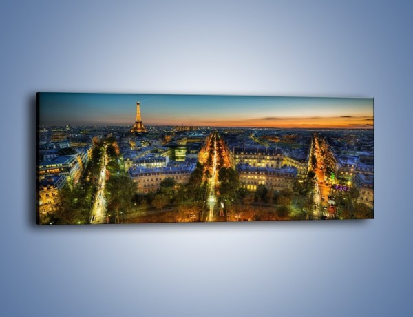 Obraz na płótnie – Rozświetlony Paryż wieczorową porą – jednoczęściowy panoramiczny AM549
