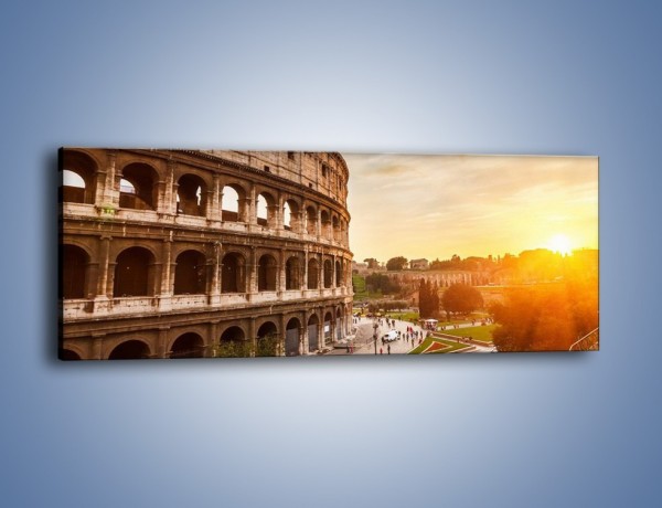 Obraz na płótnie – Rzymskie Koloseum o zachodzie słońca – jednoczęściowy panoramiczny AM684