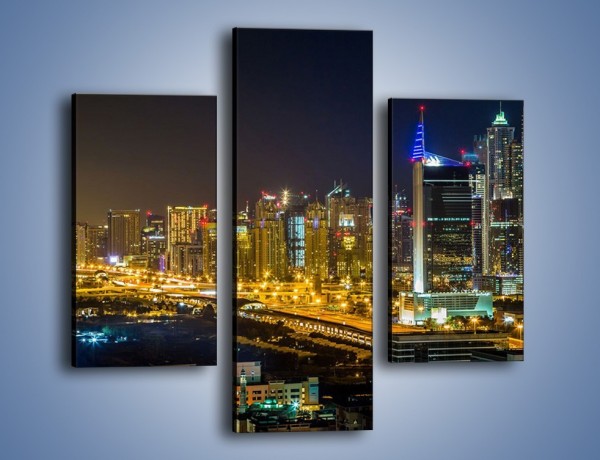 Obraz na płótnie – Oświetlony Dubaj nocą – trzyczęściowy AM506W3
