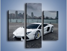 Obraz na płótnie – Lamborghini Aventador na tle miasta – trzyczęściowy TM197W3